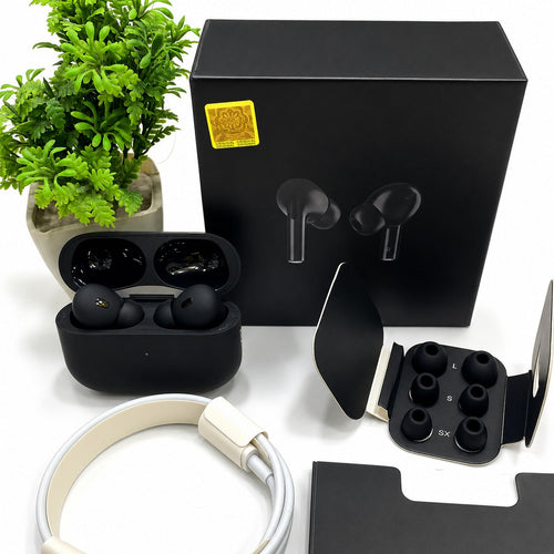 Black Pro 2 earbuds in open charging case held in hand