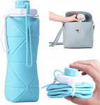 Blue collapsible silicone water bottle shown expanded and folded