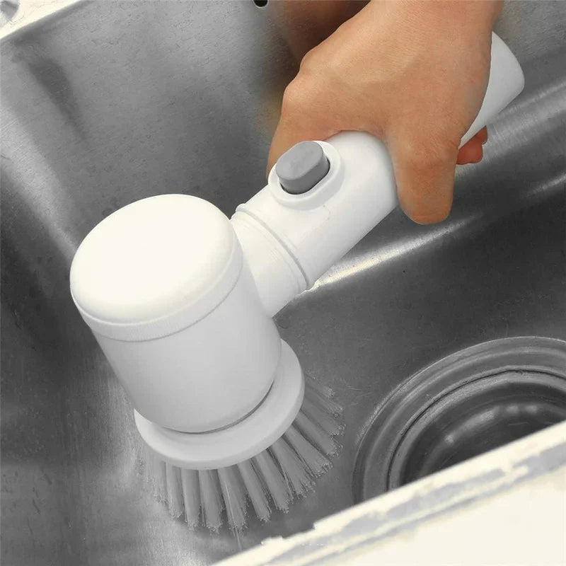 Bristle attachment on an electric cleaning brush scrubbing a kitchen sink