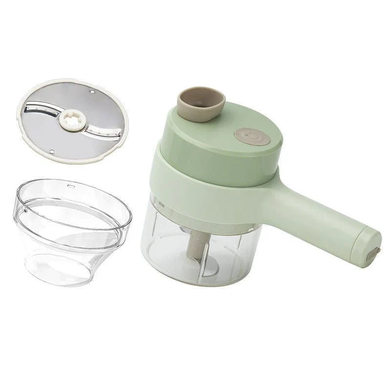 Green handheld electric food chopper with transparent bowl and slicer attachments